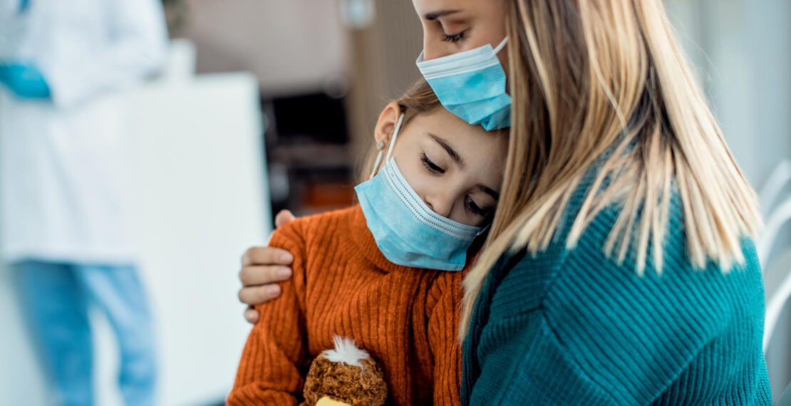 sad-little-girl-sitting-mother-s-lap-while-sitting-waiting-room-medical-clinic-during-coronavirus-pandemic